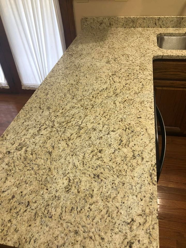 Close view of a gold and black granite countertop