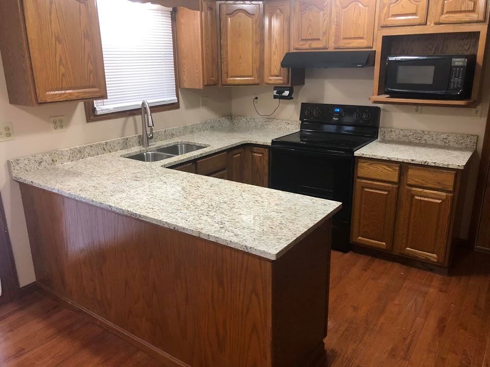 New granite countertops installed on existing oak cabinets
